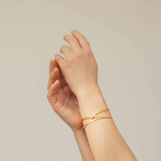 Sculptural embolic cuff bracelet