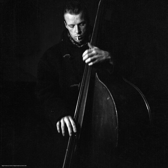 Nigel Henderson: A musician performing on a double bass