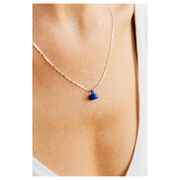 Blue ball pendant necklace on silver chain on model