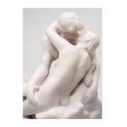 White miniature stature of a couple kissing 