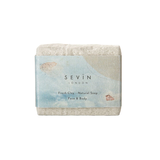 White clay soap with a card band featuring a detail from Auguste Rodin's Femme nue