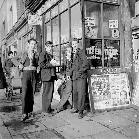 Nigel Henderson: Teenagers outside W&F. Riley, Bethnal Green