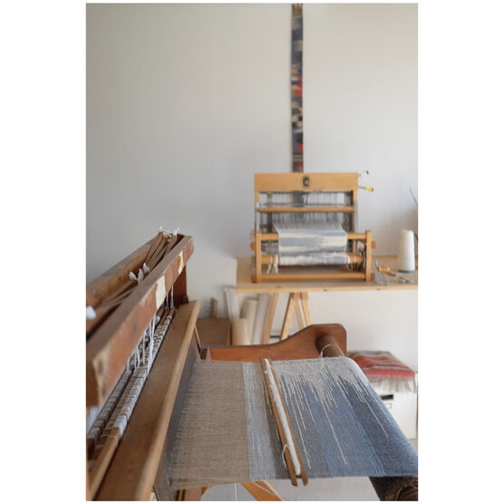 Hearth stool with woven cushion