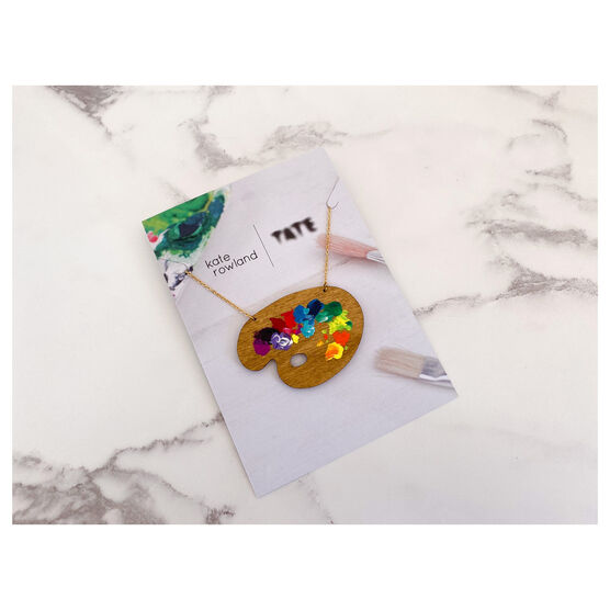 Wooden paint pallete necklace with paint splotches on card