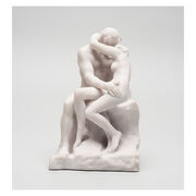 White miniature stature of a couple kissing