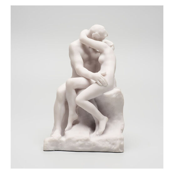 White miniature stature of a couple kissing