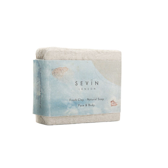 White clay soap with a card band featuring a detail from Auguste Rodin's Femme nue