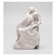 White miniature stature of a couple kissing 