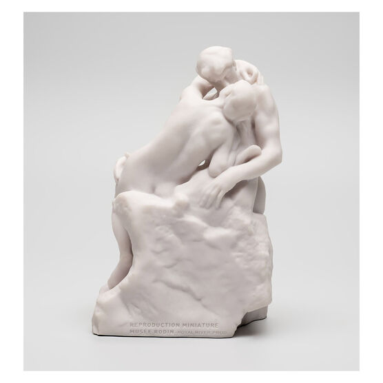 White miniature stature of a couple kissing 