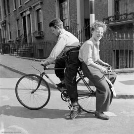 Nigel Henderson: Brian and Leslie Samuels on a bicycle, Bow