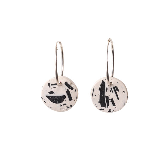 Black and white patterned circles on hoop earrings